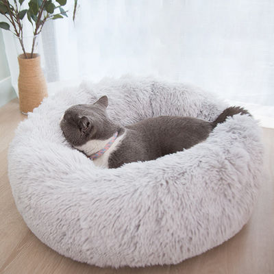 I cani molli dei gatti della ciambella della peluche calda all'ingrosso inseriscono il letto calmante del cane della pelliccia del Faux